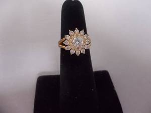 Ring-Gold Tone Band With Stones Size 5