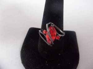 Ring-Gun Metal Tone Band Marked 10k With Fiery Orange Stone Size 11
