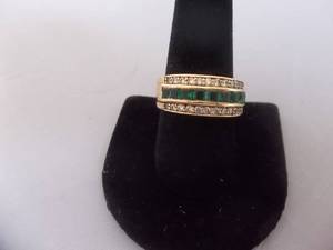 Ring-Gold Tone Band Marked 10KT With Green Stones Size 10