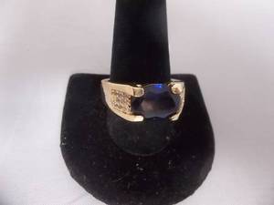 Ring-Gold Tone Band Marked 10KT With Blue Stone Size 12