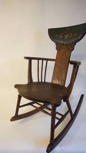lot 57 image: Early 1900s The Rocking Chair Company Rocker is Solid Oak w Leather Tacked Headrest with SerpentsDogsShieldChains