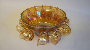 lot 63 image: Indiana Glass Amber Gold Iridescent Carnival Glass Punch Bowl Set with Twelve Cups and Hooks Harvest