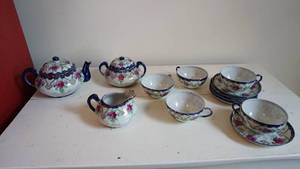 lot 106 image: Hand Painted Post War Japan-Nippon Factory Covered Teapot & Covered Sugar & Creamer & Five Matching Cups & Saucer Sets