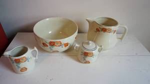 lot 109 image: Vintage Halls Orange Poppies Superior Quality Kitchenware-Vintage Hall Mixing Bowl-Sugar & Creamer & Water Pitcher