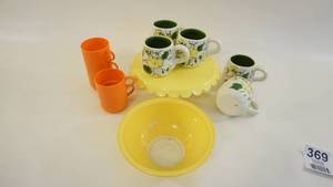 lot 369 image: Metal Pedestal Cake Server -Hand Painted Coffee Mugs -Five Stacking Picnic Cups -Yellow Pyrex() Bowl