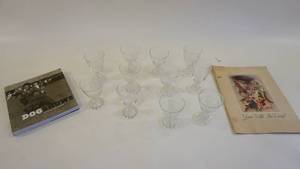 lot 373 image: UPSIDE-DOWN Dog Shows Book -Antique Theatre Booklet Gone With the Wind -Set of Eleven Etched Wine Goblets