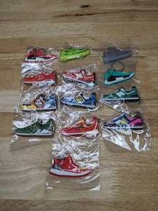 lot 71 image: Collection of 13 Brand New Adidas and New Balance Shoe Sneaker Keychains Kanye West Yeezy HMD 574 - T