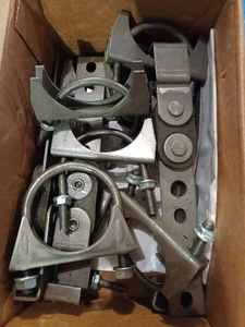 Box of New Muffler Clamps and Exhaust Hangers and a Bottle Jack with Handle - Works