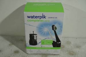 lot 124 image: NEW Waterpik Complete Care 5.0 Flosser and Toothbrush