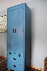 Medium Blue Colored Storage Cabinet With Two Doors & Three Drawers-When Outside Doors Are Opened Up There Are Three Divided Shelving
