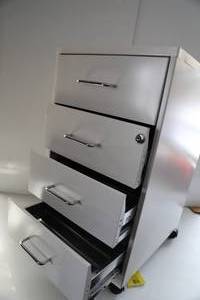 Four Drawer Metal File Cabinet On Casters-It Has A Lock On It--Keys Are Included.