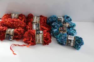 Six Skeins Of Bernat Boa Orange Yarn--Three Skeins Of Bernat Boa Variegated Blue Yarn