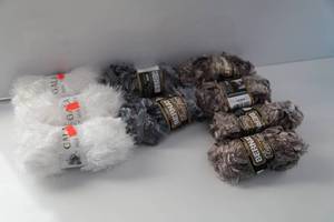 Three Skeins Of White Gala Mixed Fiber Yarn-Two Skeins Of Grey Bernat Boa Furs Yarn-Four Skeins Of Light Brown Bernat Boa Furs Yarn