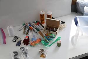 Colored Markers-Small Black & White Jeep-Blue Ice Skates On Twine-Purple Gloves-Green & Blue Ribbon-Spool Of Thread-Sewing Machine Bobbins Filled With Thread