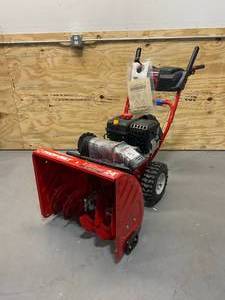 lot 84 image: TROY-BILT 24 in. 208 cc Two-Stage Gas Snow Blower with Electric Start Self Propelled