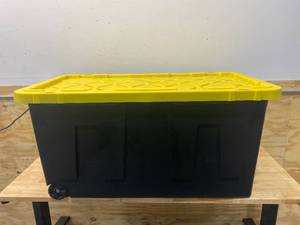lot 118 image: HDX 70 Gal. Tough Storage Tote with Wheels in Black with Yellow Lid