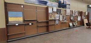 Retail Wall-mount Pegboard and Shelf Uprights (4ft wide per section). 10ft tall. Artwork will be removed prior to pickup (ARTWORK NOT INCLUDED).