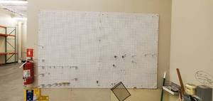 Wall Mounted Pegboard With Assorted Pegs