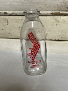lot 43 image: Jar of Marbles, Porcelain Figures, Glass Pasteurized milk jar Lebanon TN