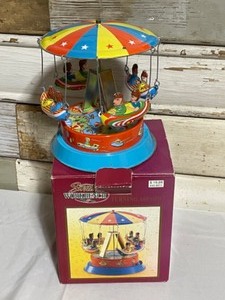 lot 57 image: Santas Workbench Turning our Ship, Fairy Clock, Serta Sheep (2), Wind Up Dog, Firestone Tire Ashtray