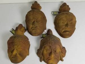 lot 97 image: Garden Art Faux Stone Faces 4 Pcs