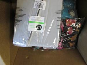 box of curtains and cosmetic organ...