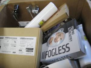 box of shower caddys, toilet brushe...