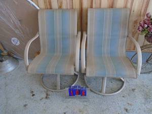 Patio set. Includes 4 chairs, table, umbrella & stand. Pictures only show 2 chairs but there are 4 in total. As shown.