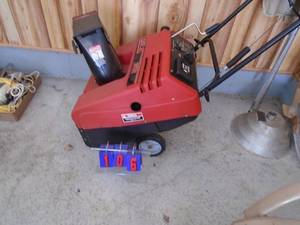 Spirit 4.5 hp snow thrower. 2 cycle. Turns over. Consignor states it runs. As shown.