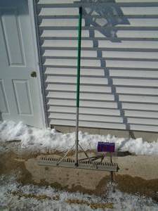 Aluminum lake weed rake. As shown.