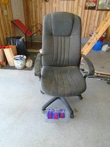 1 black fabric office chair. Could use a good cleaning. As shown.