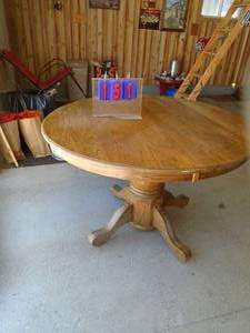 Round oak pedestal table. Approx 42. As shown.