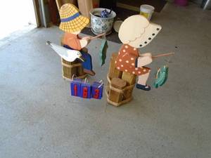 Qty of 2 wood fishing statues. Look new. As shown.