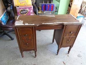Vintage wood desk. Nice shape. Foam on top should come off easily. As shown.