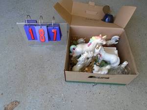 Box of unicorn figurines. As shown.