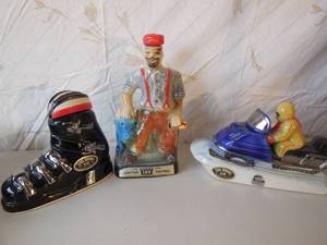 lot 63 image: 2-Ezra Brooks Bottles Ski Boot, Snowmobile, 1-Beam Bottle Paul Bunyan