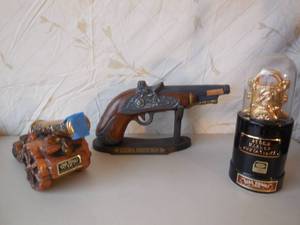 lot 65 image: 3-Ezra Brooks Bottles Cannon, Pistol, Ticker Tape Machine