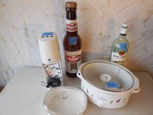 lot 112 image: Crock Pot , Casserole Dish, Soda Stream Machine (No Bottle), Large Rum Bottle, Plastic Schmidt Bottle Bank