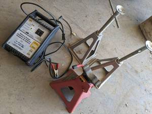 lot 39 image: Napa Battery Charger and 3 Jack Sta...