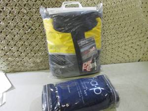 lot 24 image: (F-1) Elite Rainsuit and Travel Com...