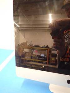 lot 105 image: Apple iMac10,1 A1311 All-in-One PC &nbspINTEL(R) CORE(TM)2 DUO CPU E7600  3.06GHZ  8GB DDR3 SDRAM  500GB HD  Unit wont load IOS  includes power cable  cracked screen