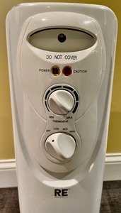 lot 57 image: RE Room Essentials Space Heater on Casters