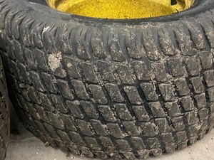 lot 12 image: (2) Turf Master 24x12.0012 NHS Turf Tires On 4-Lug John Deere Wheels