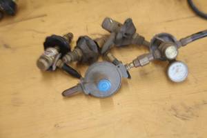 lot 1073 image: Helium Valve Heads (x3), Valve Head with Regulator (x1)