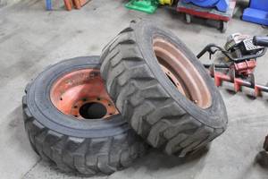 lot 966 image: Lot of (2) Bobcat Heavy Duty 10-16.5 MHS Skid Loader Tires with 8-Lug Wheels