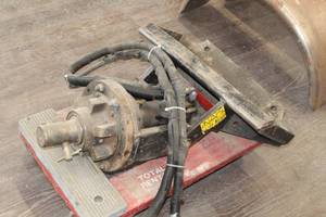 lot 976 image: Toro Dingo Auger Plate Attachment - Mount is bent