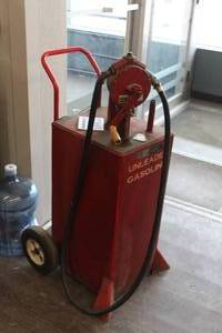 lot 1098 image: Unleaded Gasoline Gas Caddy Portable Metal Tank with Tuthill Series 100 Hand-Operated Fuel Pump