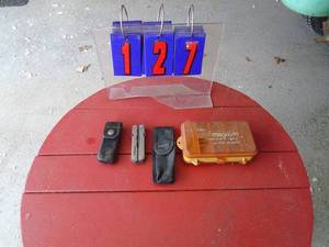 Leatherman tool in sheath with spare sheath & small tackle box. As shown.