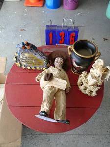 Box with vase, angel statue, solar birds & cowboy. As shown.
