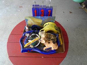 Flat with bobble heads, caution tape & large ashtray. As shown.